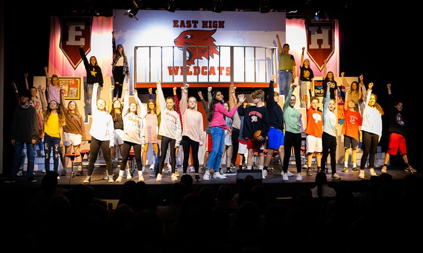Students dance onstage